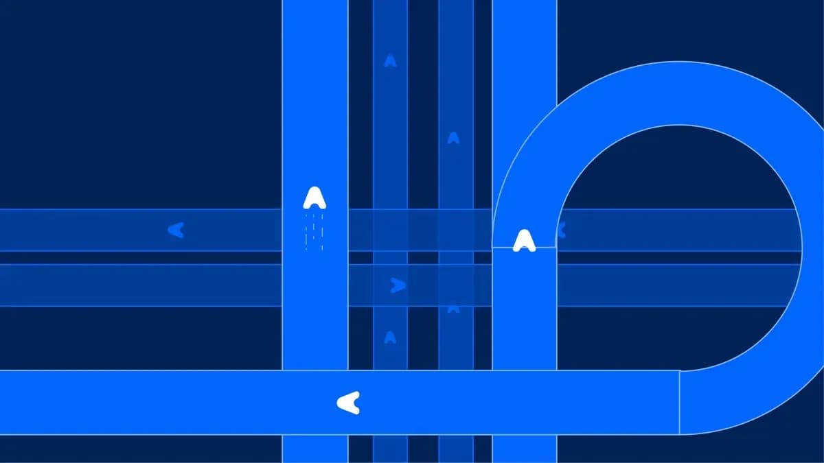 Blue lanes crossing and looping on a navy ground, with arrows moving along each route